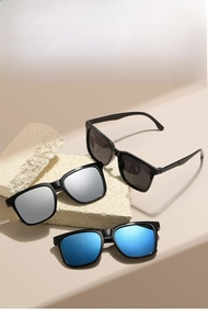 Detailed view of square sunglasses with black, silver, and blue reflective lenses