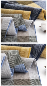 Close-up detail of herringbone pattern on soft imitation cashmere winter scarf