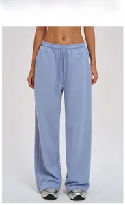 Detail of high waist grey blue wide leg sweatpants with adjustable drawstring waistband