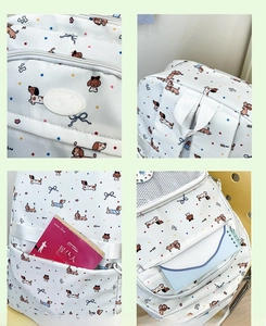 Detail view of the cute dachshund backpack with mesh pocket and rubber brand logo