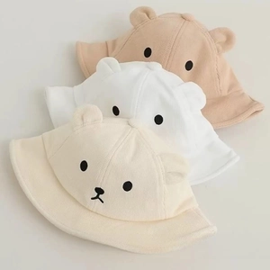 Detailed view of three baby bucket hats with cute 3D ears and animal face embroidery