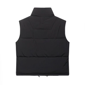Back view of black quilted vest featuring a stand-up collar and adjustable drawstring hem