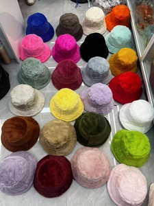 Detailed view of various color options for the fluffy faux rabbit fur bucket hat collection