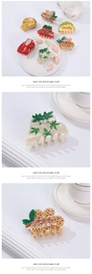 Detailed view of medium fruit-shaped hair claws with translucent jelly texture