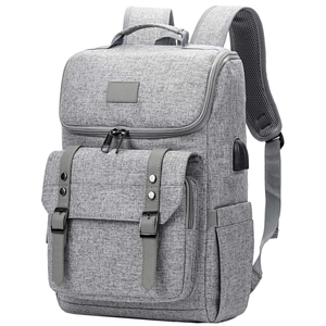 Detail of grey Oxford fabric backpack with vintage buckle straps and external USB port