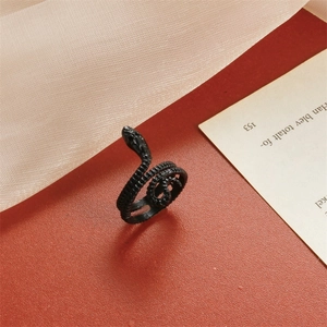 Macro view of black snake ring with detailed scale texture and coiled wrap design
