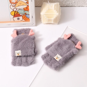 Detail of dark grey plush fingerless flip gloves with cute pink antlers and deer tag