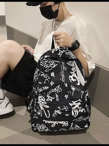Minimalist black graffiti backpack with white star patterns and Santa Monica script