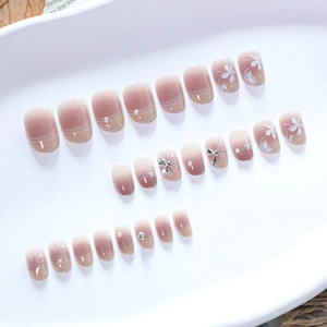 Short round gradient pink press-on nails with white flowers and pearls, 24-piece set