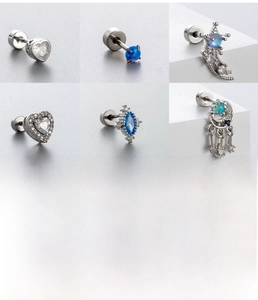 Detail of blue zircon titanium steel stud earrings with 0.8x6mm bar and flat back disc
