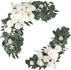 Detail of two white rose and eucalyptus garlands for wedding arch or home wall decoration