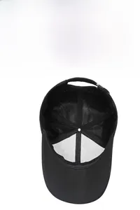 Detail view of black baseball cap interior showing breathable mesh and adjustable strap