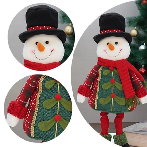 Detail of Christmas snowman plush decor featuring knit fabric textures and festive textures