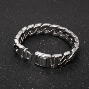 Detailed close-up of men's silver stainless steel Cuban link bracelet with square clasp