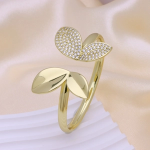 Elegant 18k gold leaf-shaped open bracelet with white zircon pave setting on silk