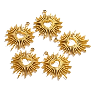Five golden heart-shaped pendants with radial sunburst design on a white background