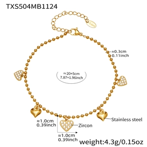 Detail of 18k gold plated stainless steel heart bracelet with zircon charms and specs