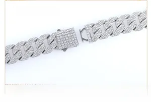 Detail of 15mm silver Cuban link chain featuring a secure iced-out spring box clasp