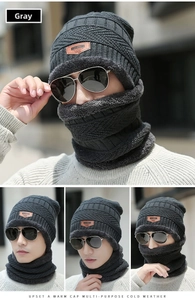 Detailed view of dark grey winter knitted hat and neck warmer with thick fleece lining