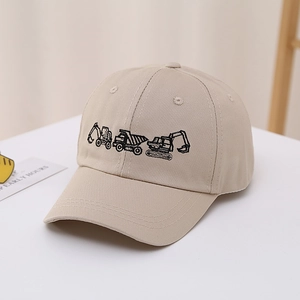 Detail of beige cotton baseball cap with excavator embroidery and curved sun visor