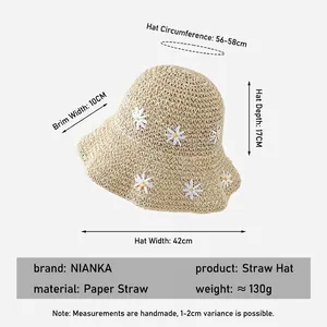 Beige straw sun hat with daisy embroidery and detailed size measurements shown