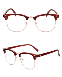 Detail of retro half-frame sunglasses featuring metal accents and rivet decoration