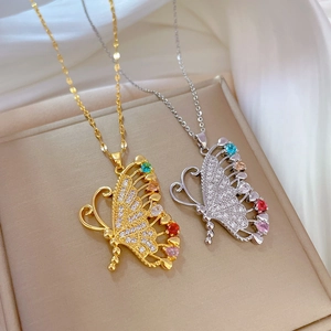 Titanium butterfly necklaces with colorful stones and diamonds on white silk background