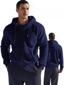 Detail of navy blue hooded fleece jacket showing zipper and soft plush fabric texture