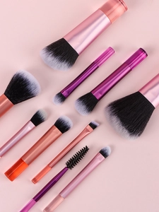 Detailed flat lay of 10-piece mini makeup brush set with pink and purple gradient handles