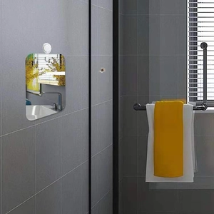 Frameless rectangular acrylic bathroom shaving mirror mounted on tile wall with suction cup