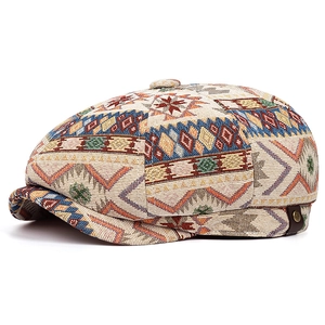 Detailed view of a vintage Bohemian woven newsboy cap featuring colorful geometric patterns