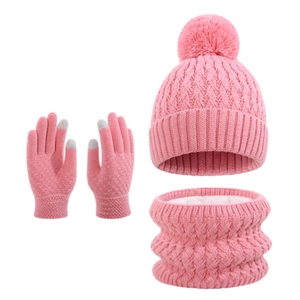 Pink knit set for kids featuring pom-pom hat, scarf and touchscreen gloves with cable pattern