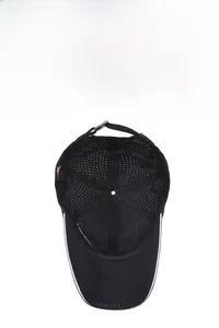 Detail view of the breathable mesh fabric and reinforced inner straps of the black sports cap