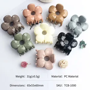 Eight-piece set of large glossy flower hair claws in multiple earth-tone colors