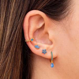Elegant gold plated earring set featuring sky blue gemstones and crown stud designs