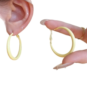Minimalist creamy yellow matte hoop earrings with golden metal clasps for women