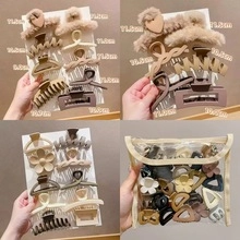 Detailed size chart for assorted resin hair claws in beige, brown, and black colors