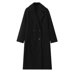 Flat lay of a black double-breasted wool blend coat with wide lapels and side pockets