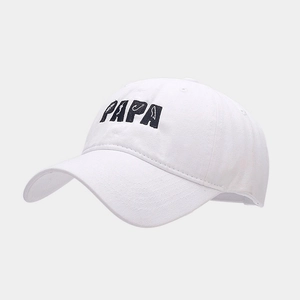 Close-up detail of blue PAPA embroidery on a white washed cotton sun hat
