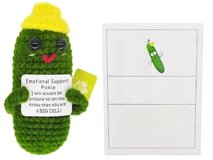 Macro detail of hand-knitted emotional support pickle plush toy with funny quote cards
