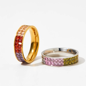 Colorful multi-gemstone stainless steel ring set with gold and silver finishes