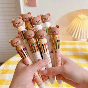 Close-up of cute cartoon bear pens with multi-color ink refills and click buttons