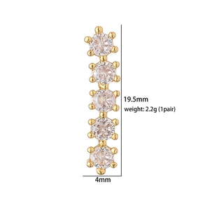 Detail view of gold bar earrings with five round cubic zirconia stones and 19.5mm size