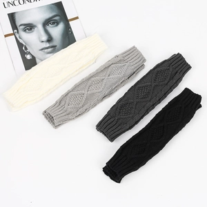 Rhombic pattern knitted arm warmers in white, grey, and black colors on a white background