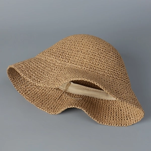 Close-up of handmade straw bucket hat showing tight woven texture and inner sweatband