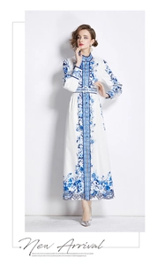 Detail of a floral maxi dress with mandarin collar and matching waist belt