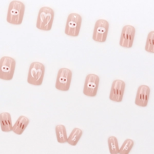 Cute peach pink pig press-on nails with minimalist heart and swirl patterns, 24 pieces set