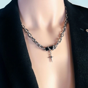 Silver necklace with black gem pendant and cross charm on a titanium steel chain