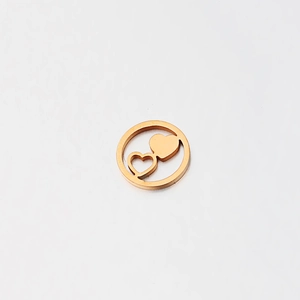 Detailed macro view of mirror polished gold hollow heart pendant made of stainless steel