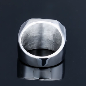 Vintage stainless steel ring with square green gemstone and carved viking patterns